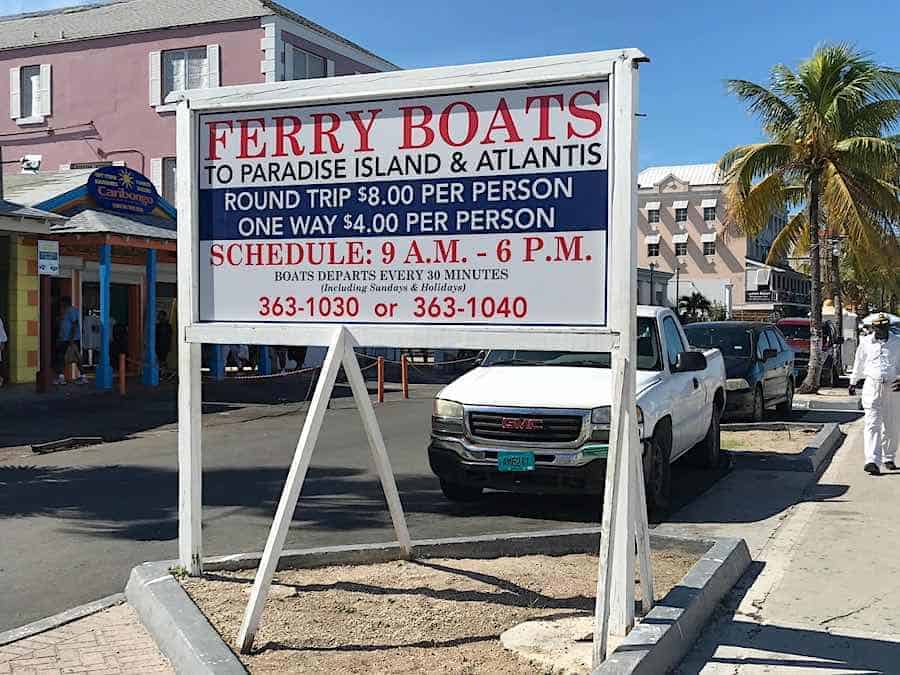 Wooden ferry boat information sign along the harbor walk.