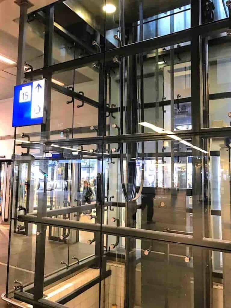 Glass elevator at Amsterdam Centraal train station.