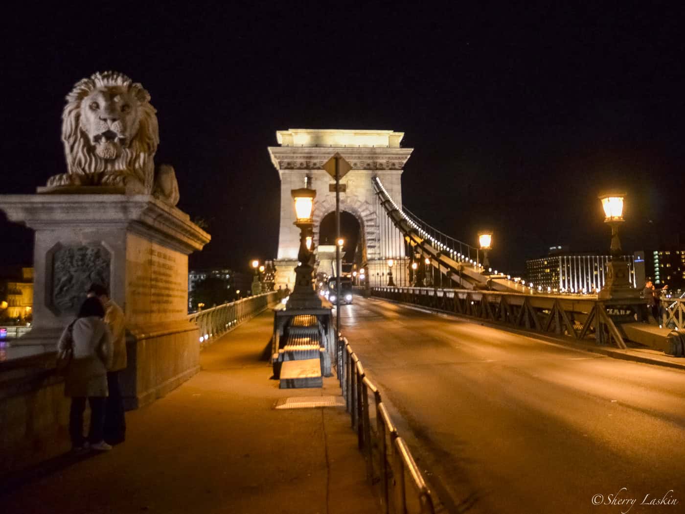 Lion statue at the beginning of Budapest's chain bridge.
