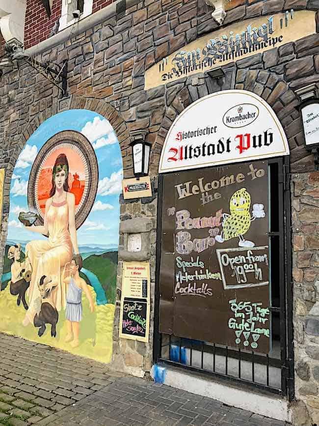 Entrance to the Peanut Bar in Koblenz with graffiti on the outside wall.