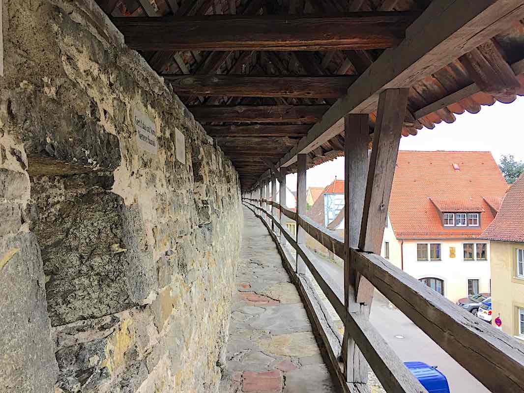 Walking along the very narrow footpath on the wall around Rothenburg.