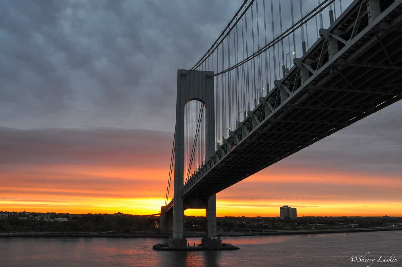 Dawn as ship passes under Verrazano Bridge in New York.