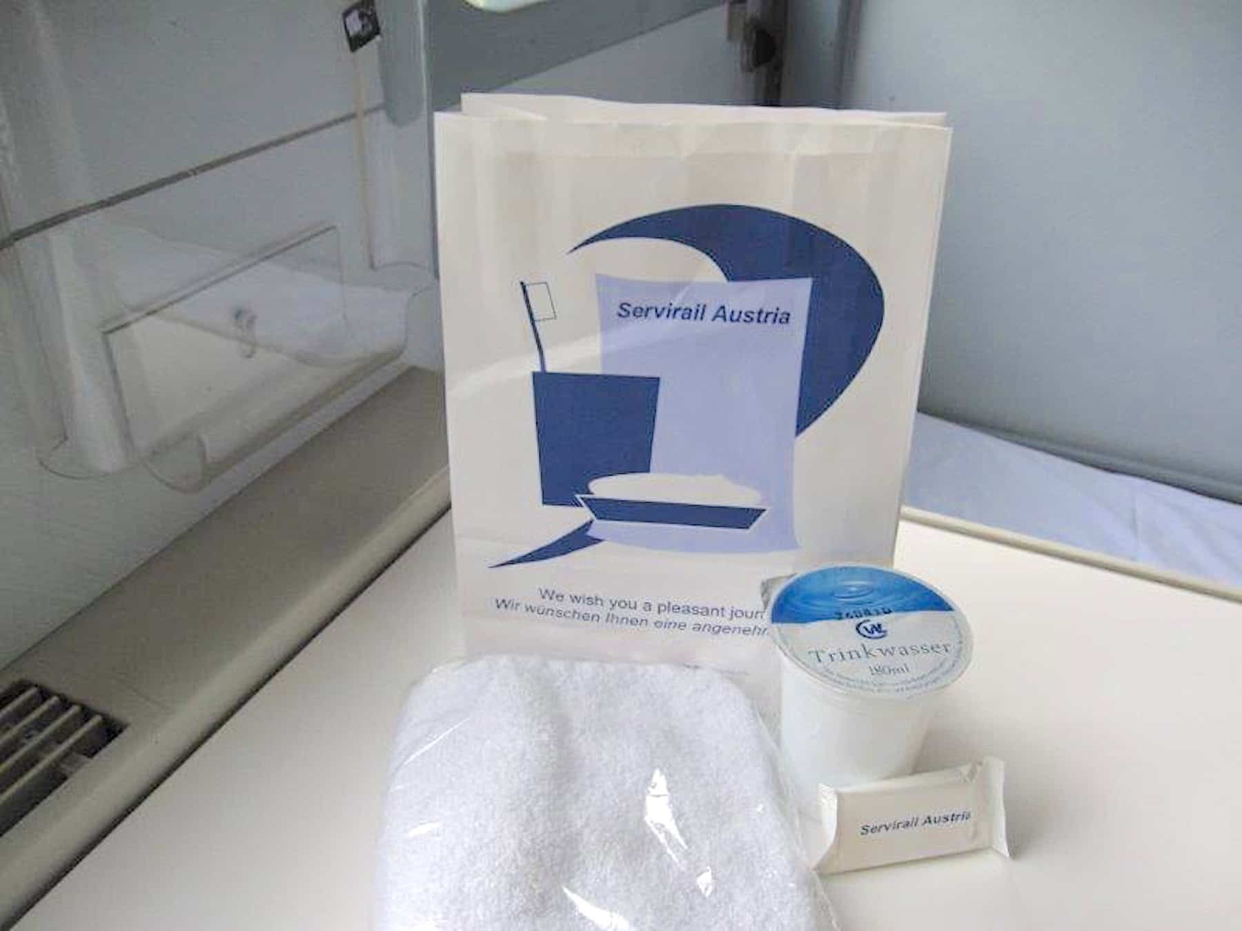 Paper bag, washcloth, soap and a cup of packaged water aboard Dacia Express.