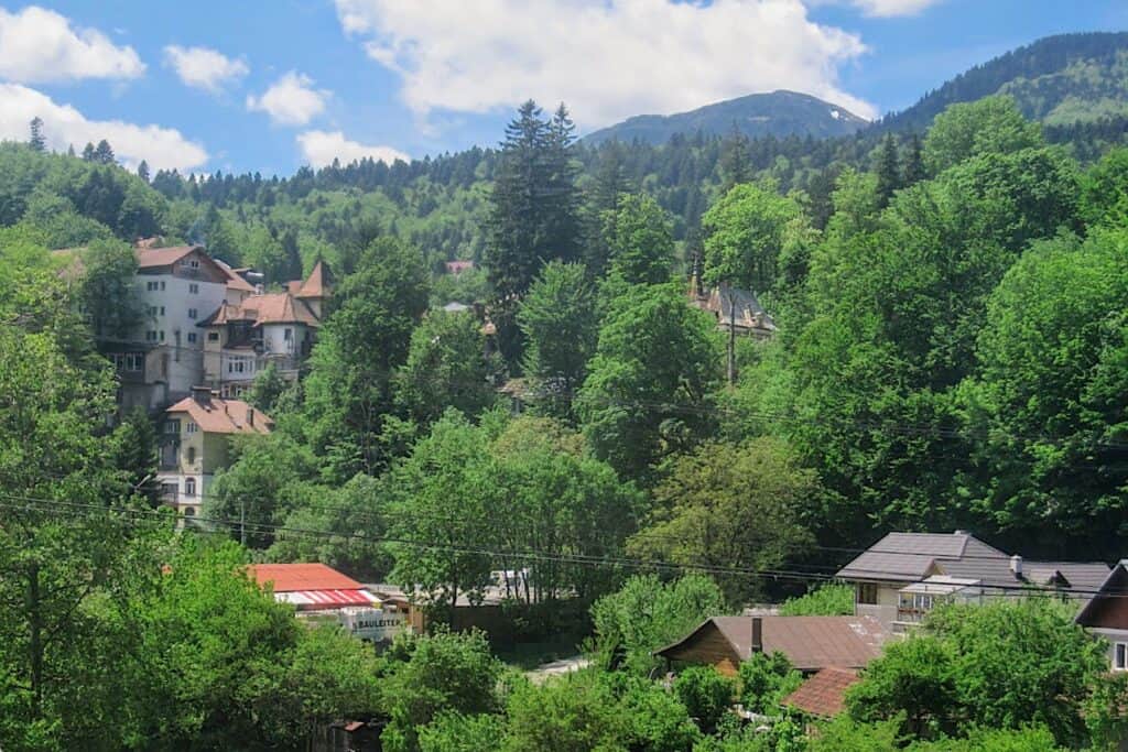 Small town with hillside buildings along the Dacia route.
