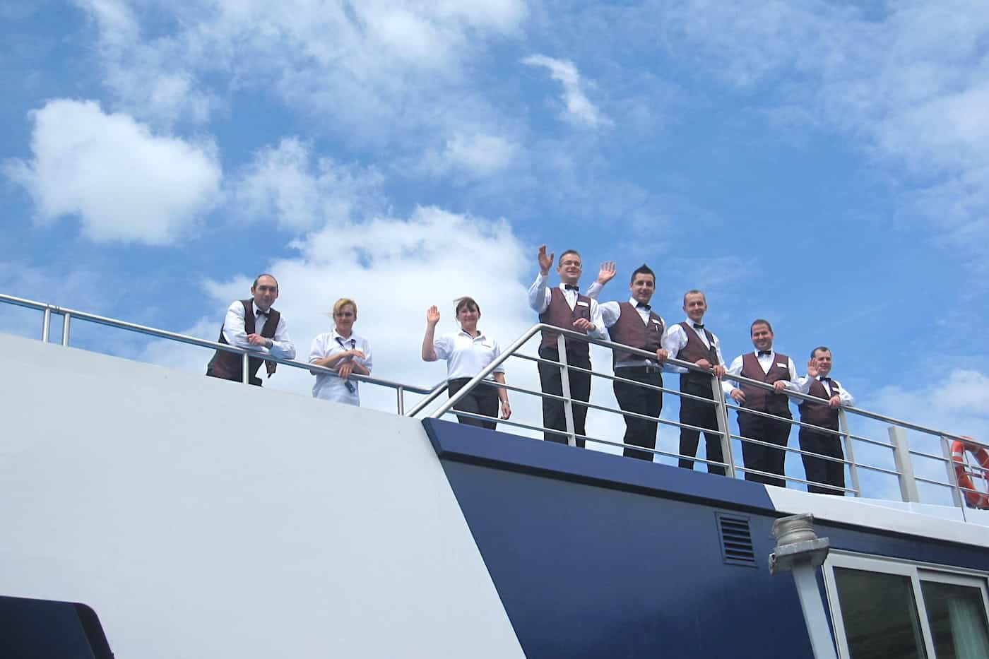 AmaLegro crew on top deck waving goodbye to me.