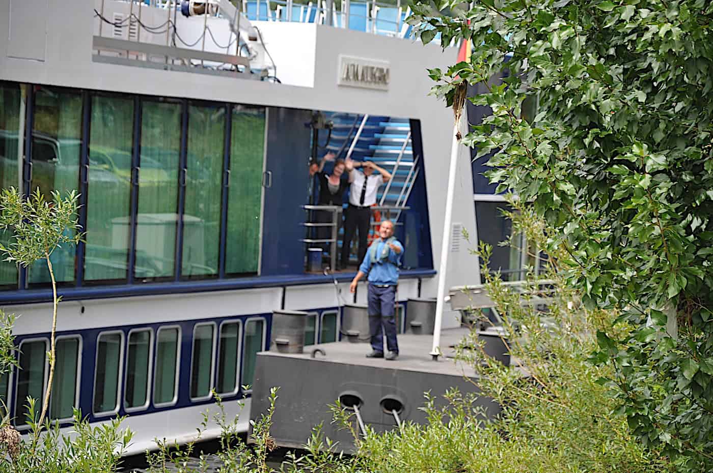 AmaLegro river ship dock somewhere in Germany with people waving goodbye.